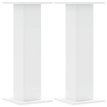 Two white speaker stands shown from the front, each with a square base and top