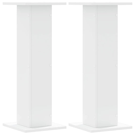 Two white speaker stands shown from the front, each with a square base and top