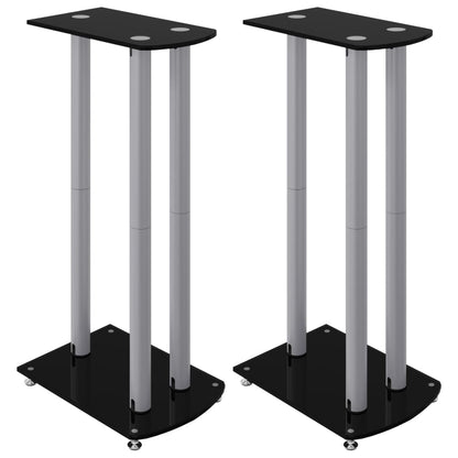 Two black and silver speaker stands with three pillars each