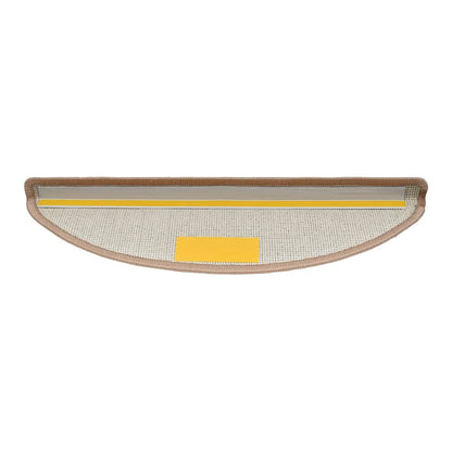 Underside of a light brown half round stair tread showing adhesive strips