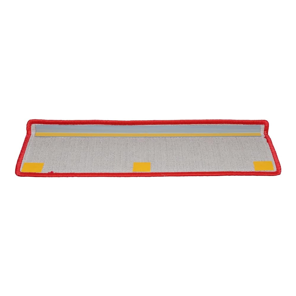 The stair treads showing the underside with adhesive strips for easy installation