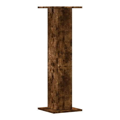 The plant stands shown from a low angle highlighting the wood grain texture