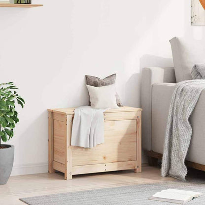 The solid wood pine storage box in a living room setting next to a sofa