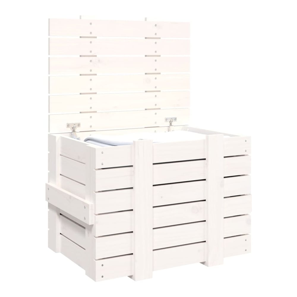 The white wooden storage chest with its lid open, revealing a folded blanket inside
