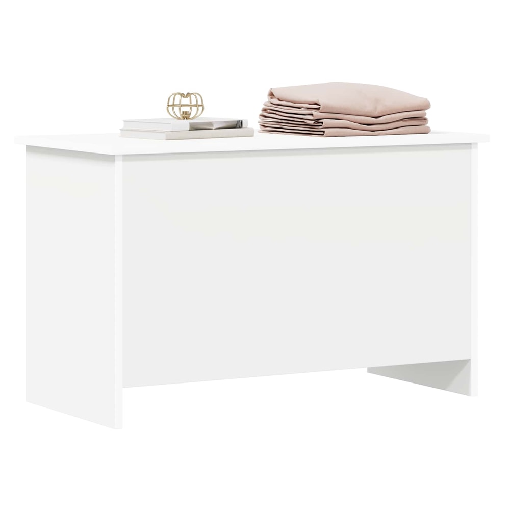 The white storage chest with items on top