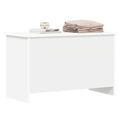 The white storage chest with items on top