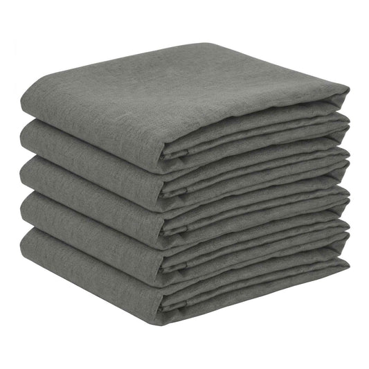 five folded rectangular light grey tablecloths stacked on top of each other
