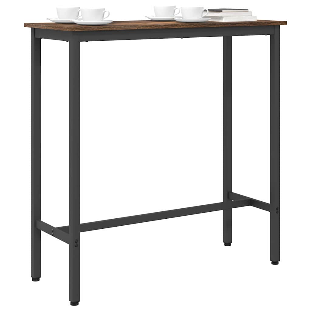 A tall rectangular table with a smoked oak effect top and black metal legs