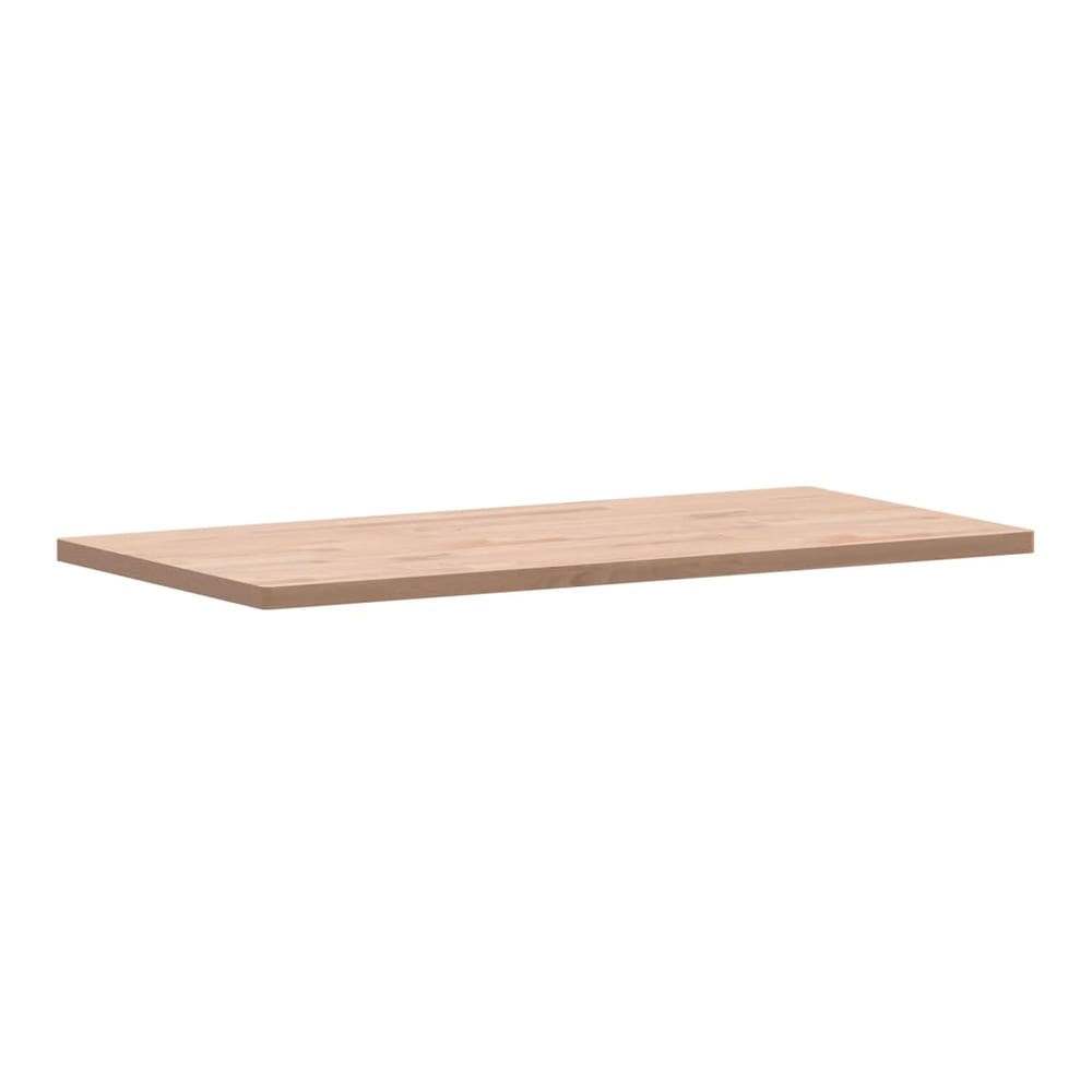 The rectangular solid wood beech table top shown from a side angle