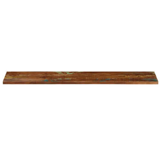 A long plank table top viewed from the side, showing its thickness and rustic texture