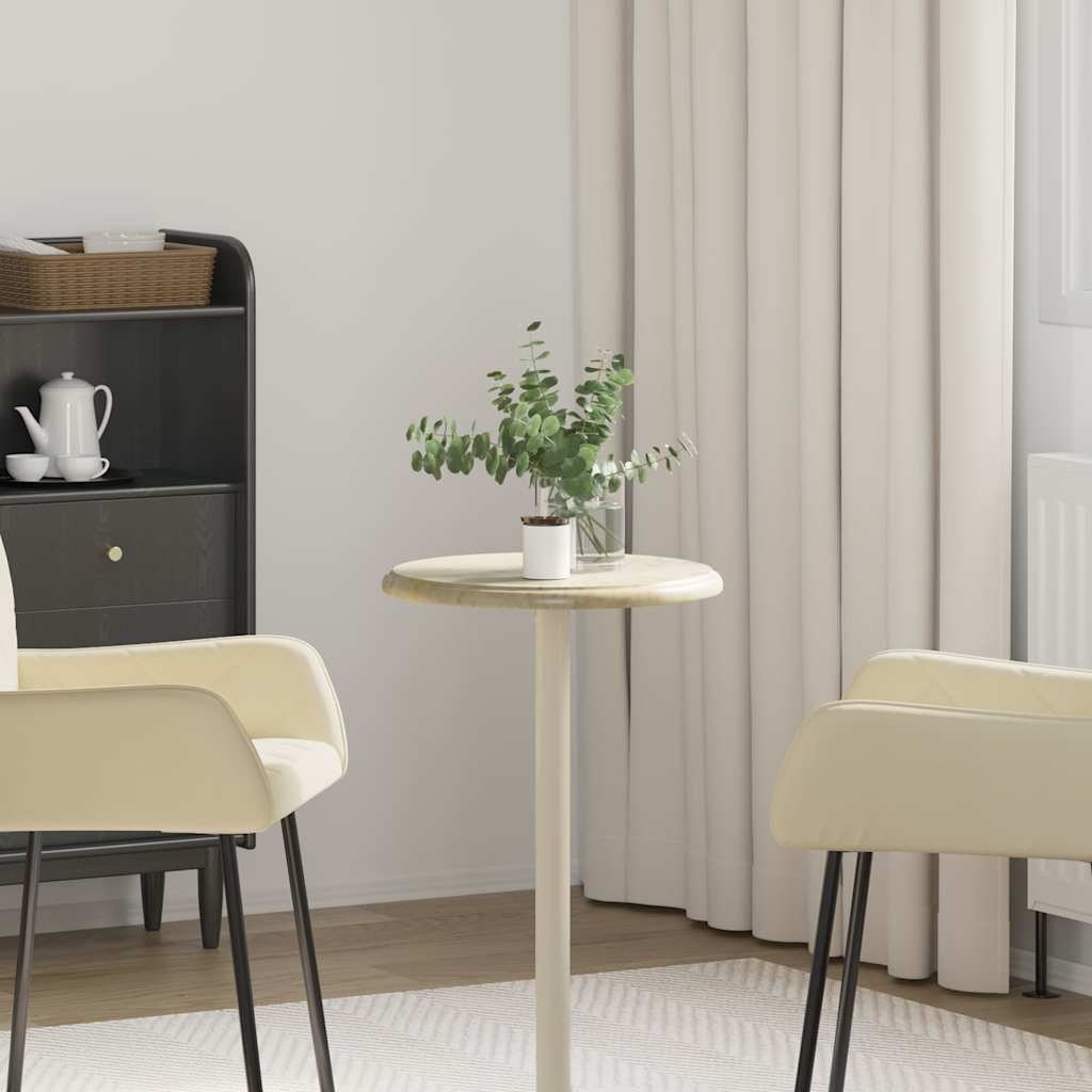 Table Top Cream Marble shown in a room setting with two chairs and a plant