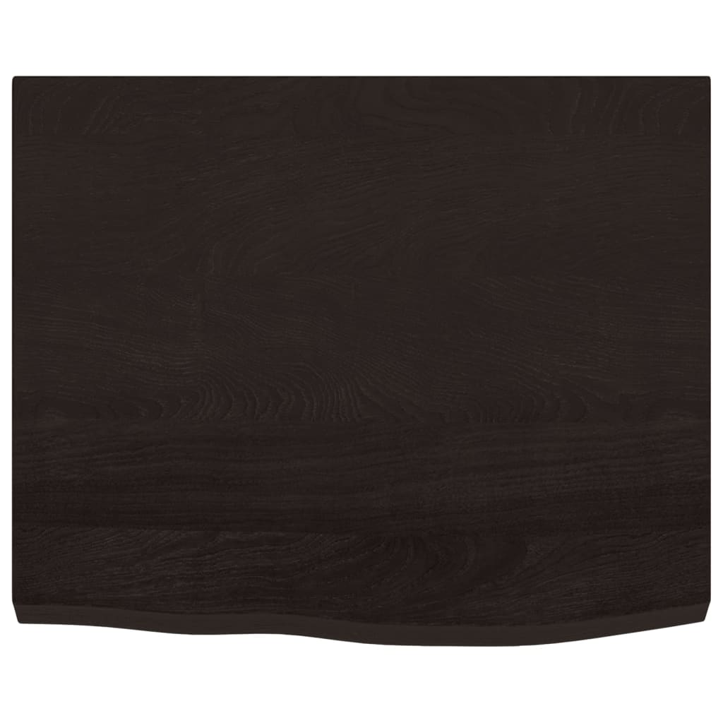 A close-up view of the dark brown wooden table top surface