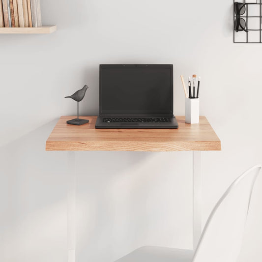 vidaXL Table Top Light Brown Treated Solid Wood Oak mounted as a desk with a laptop on top