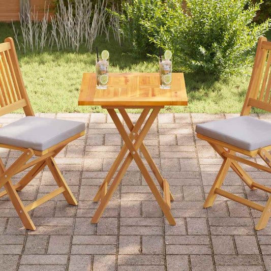 vidaXL Table Top Solid Teak Wood shown on a small garden table between two chairs on a patio