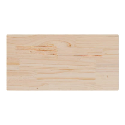 A single rectangular solid wood pine table top shown from above