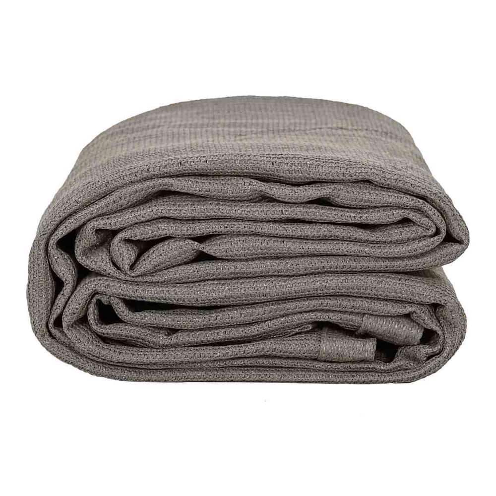 The light grey tent carpet folded in half