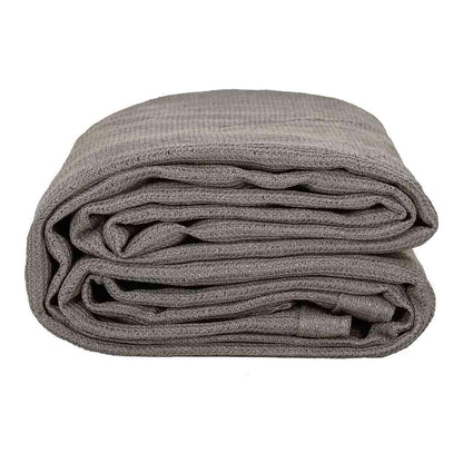 The light grey tent carpet folded in half