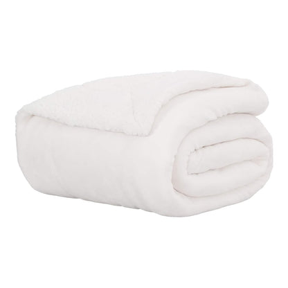 A white fleece throw blanket neatly rolled up on a white surface
