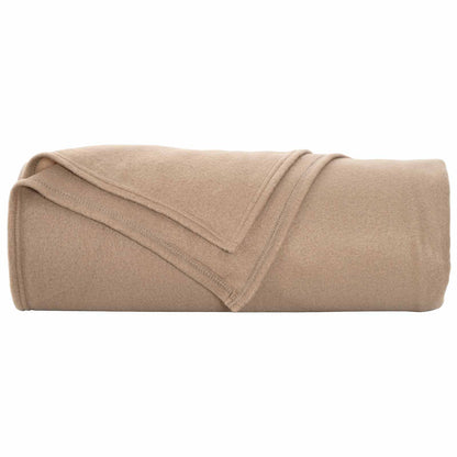 the fleece blanket folded and rolled on a plain white surface