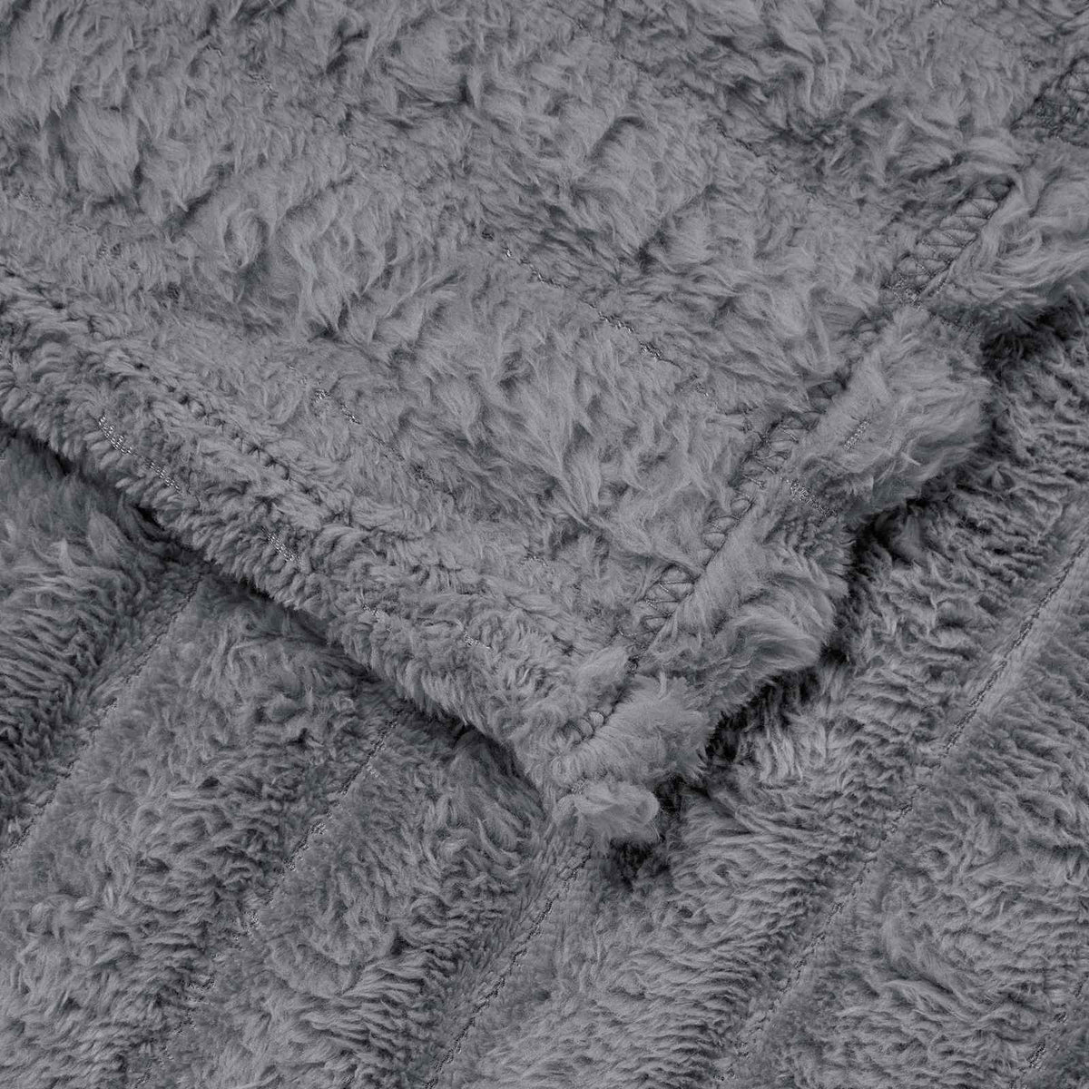 Close-up texture of a dark grey fleece blanket