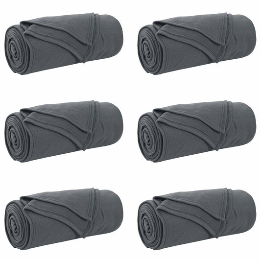Six dark grey fleece blankets rolled up and placed side by side