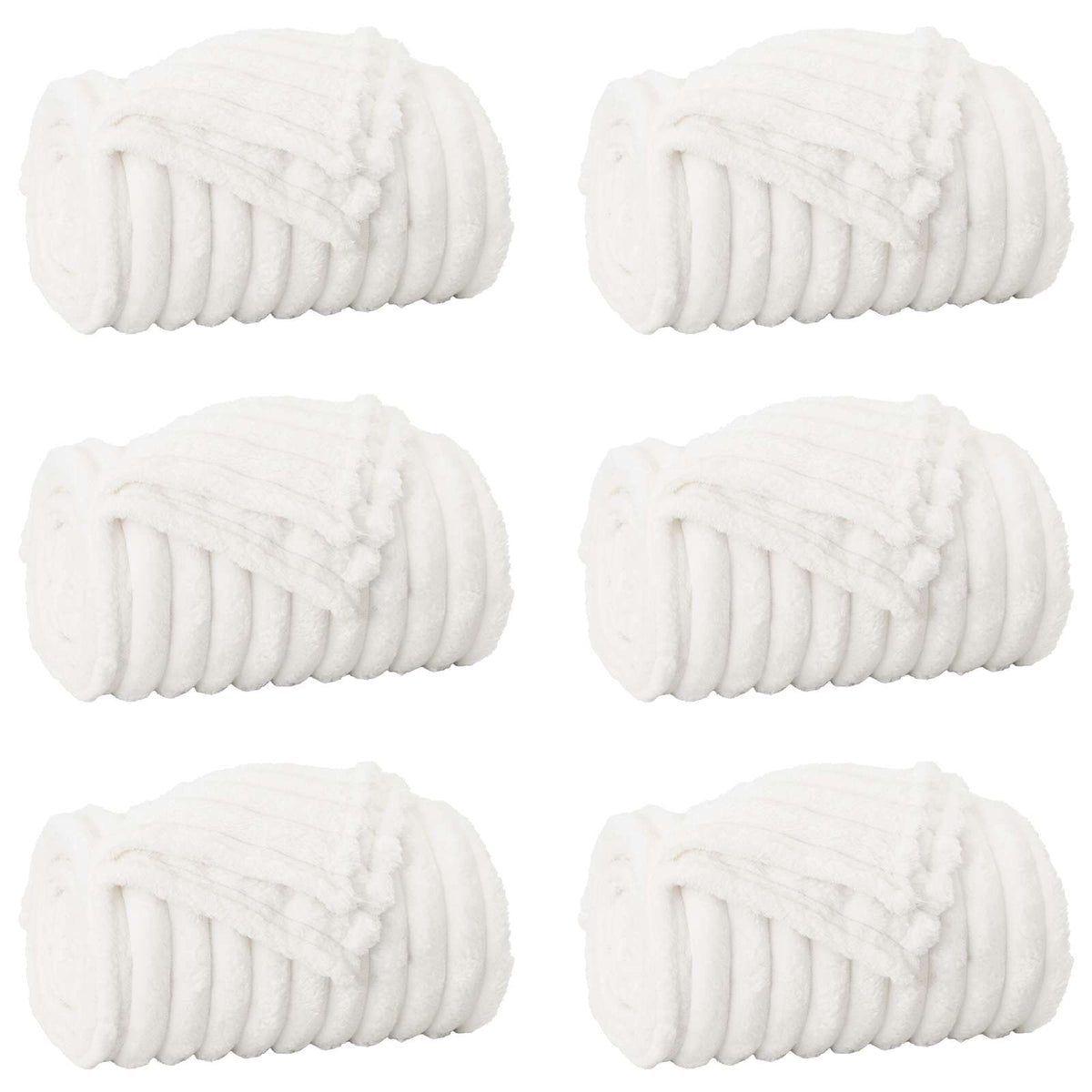 Six white fleece blankets rolled up and arranged in two rows