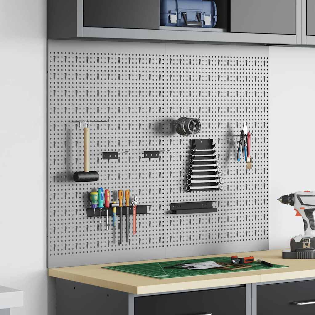 the grey steel tool storage panel mounted on a wall above a workbench