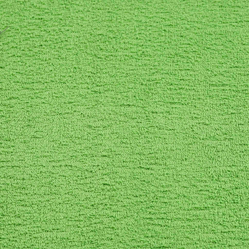 the green fabric texture showing the soft looped pile of the bathroom towels