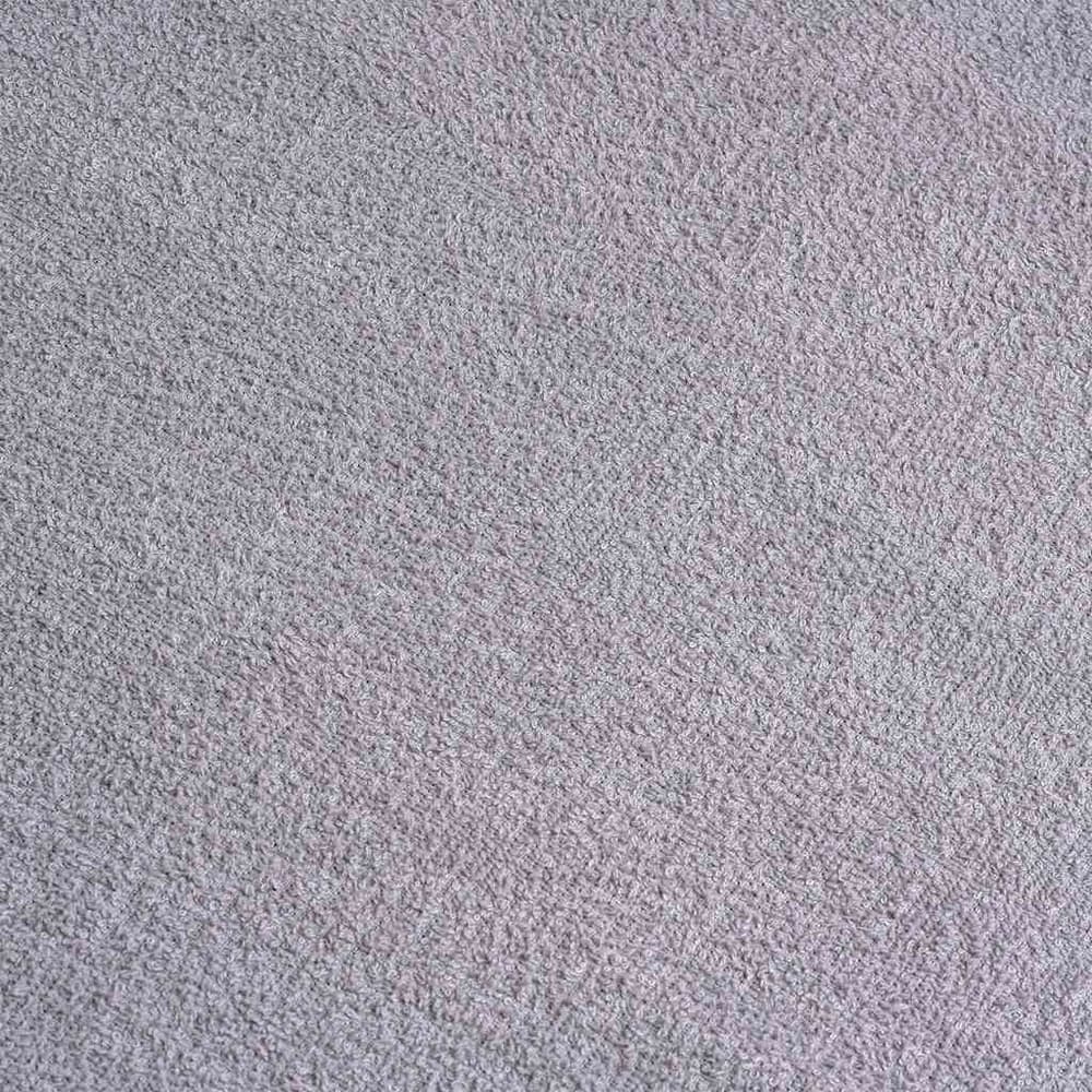 Close up of the textured fabric of a grey towel