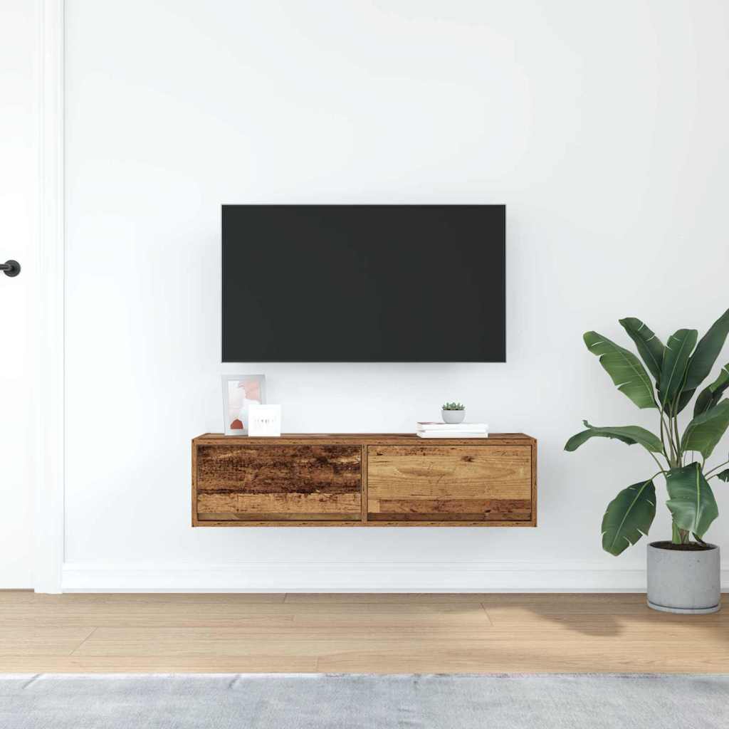 The wall mounted TV cabinet positioned in a bright living room with a potted plant nearby