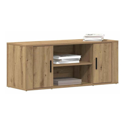 The TV cabinet with two doors and open shelves, stacked books on top