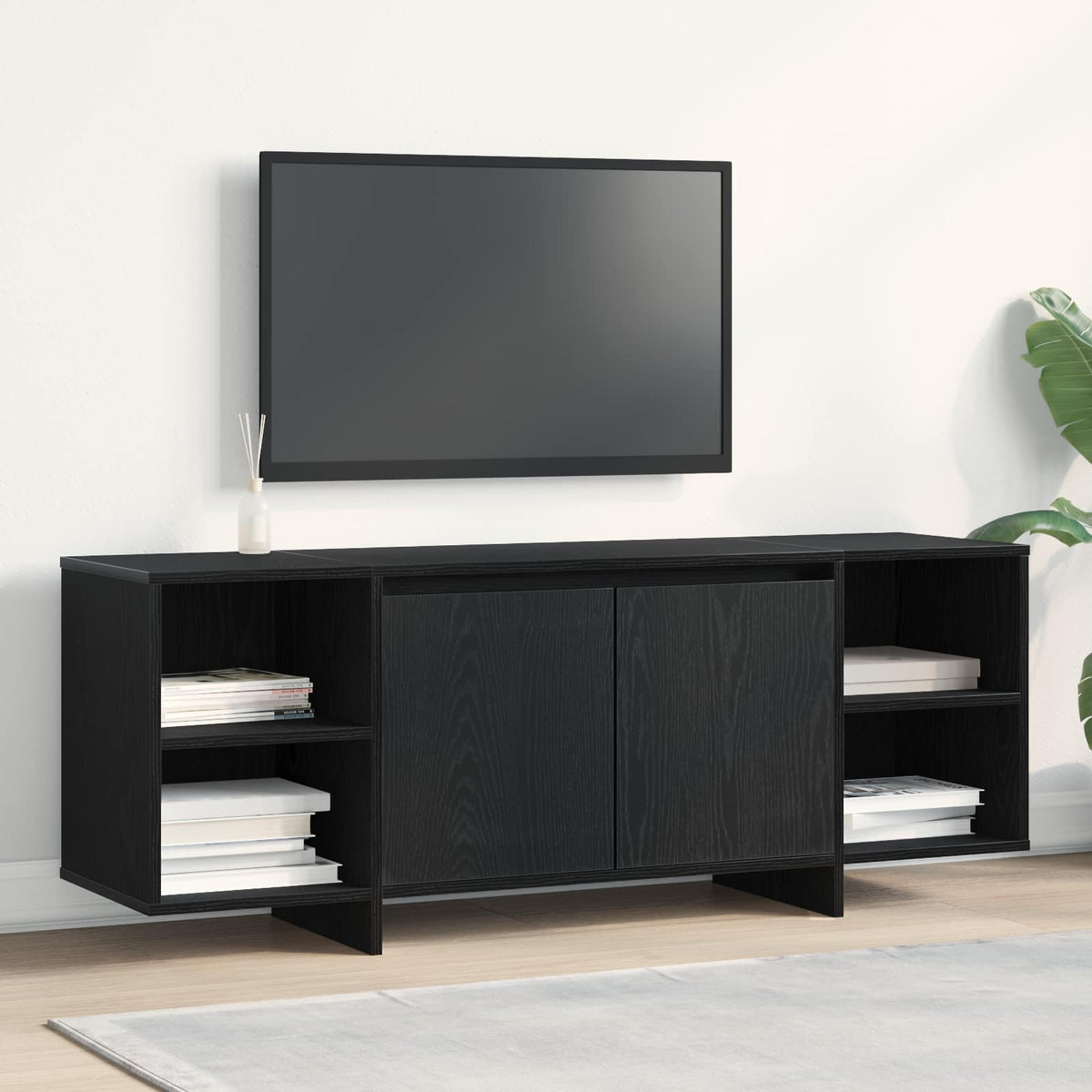 Black oak engineered wood TV cabinet in a room with a television above