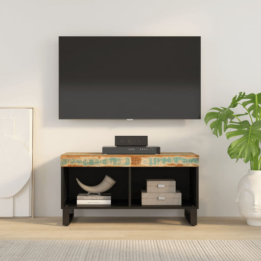 vidaXL TV Cabinet Solid Wood Reclaimed with a TV on top and a plant to the side