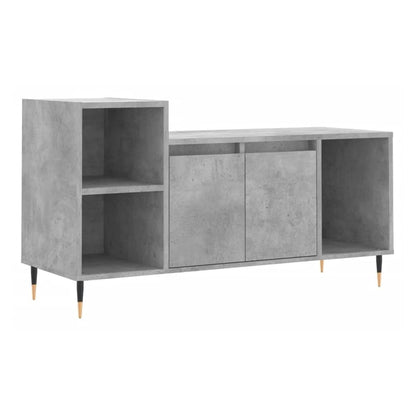 The concrete grey TV cabinet showing open shelving on the left and closed storage on the right