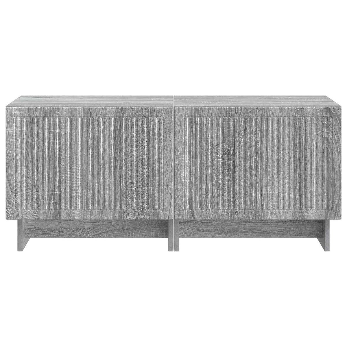 The TV cabinet viewed directly from the front showing the textured door panels