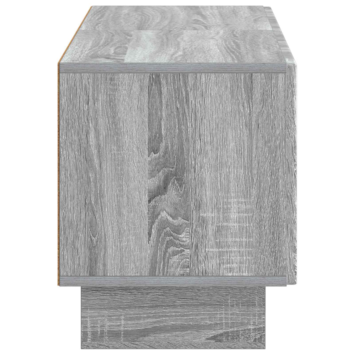 A close up of the side panel of the TV cabinet showing the wood grain texture
