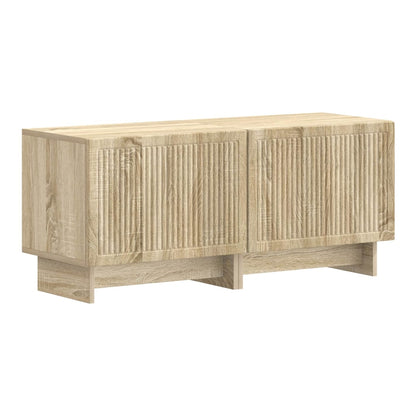 The TV stand is made of engineered wood with a sonoma oak finish and ribbed doors