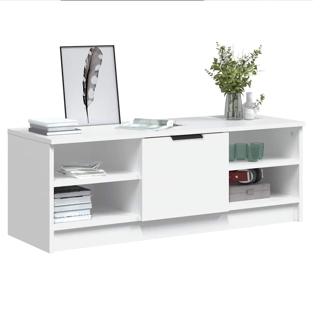 the white engineered wood TV cabinet with items on shelves and in compartments