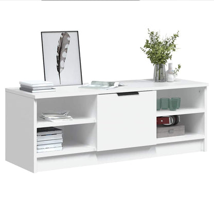 the white engineered wood TV cabinet with items on shelves and in compartments