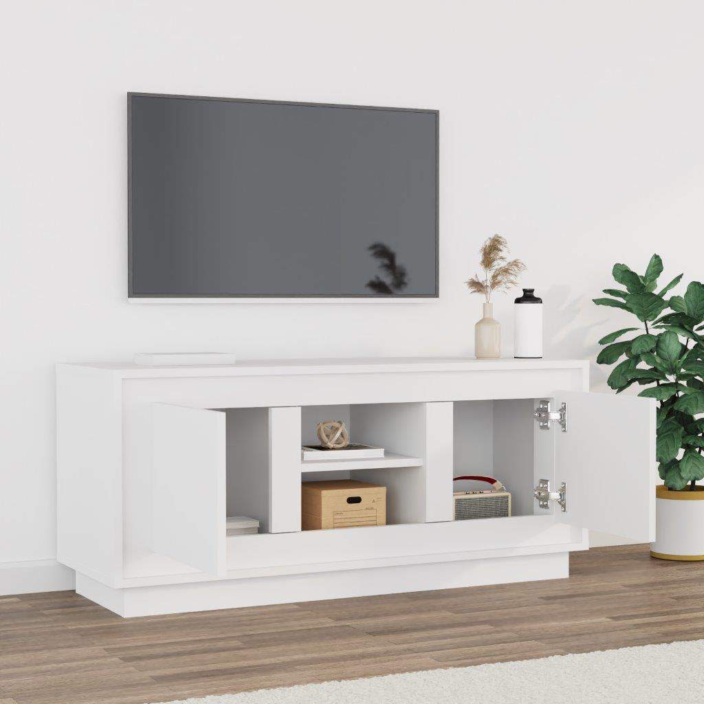 The white engineered wood TV cabinet with doors open showing storage space