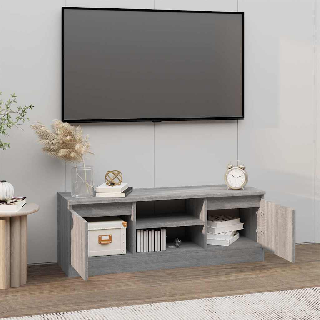 entertainment centre with a television on top, showing the cabinet doors open