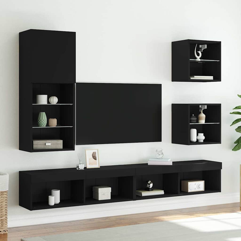the entertainment centre in a modern living room with a television and other cabinets