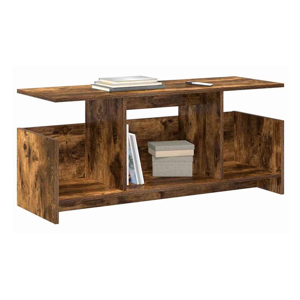 The TV stand with books and boxes placed on its shelves