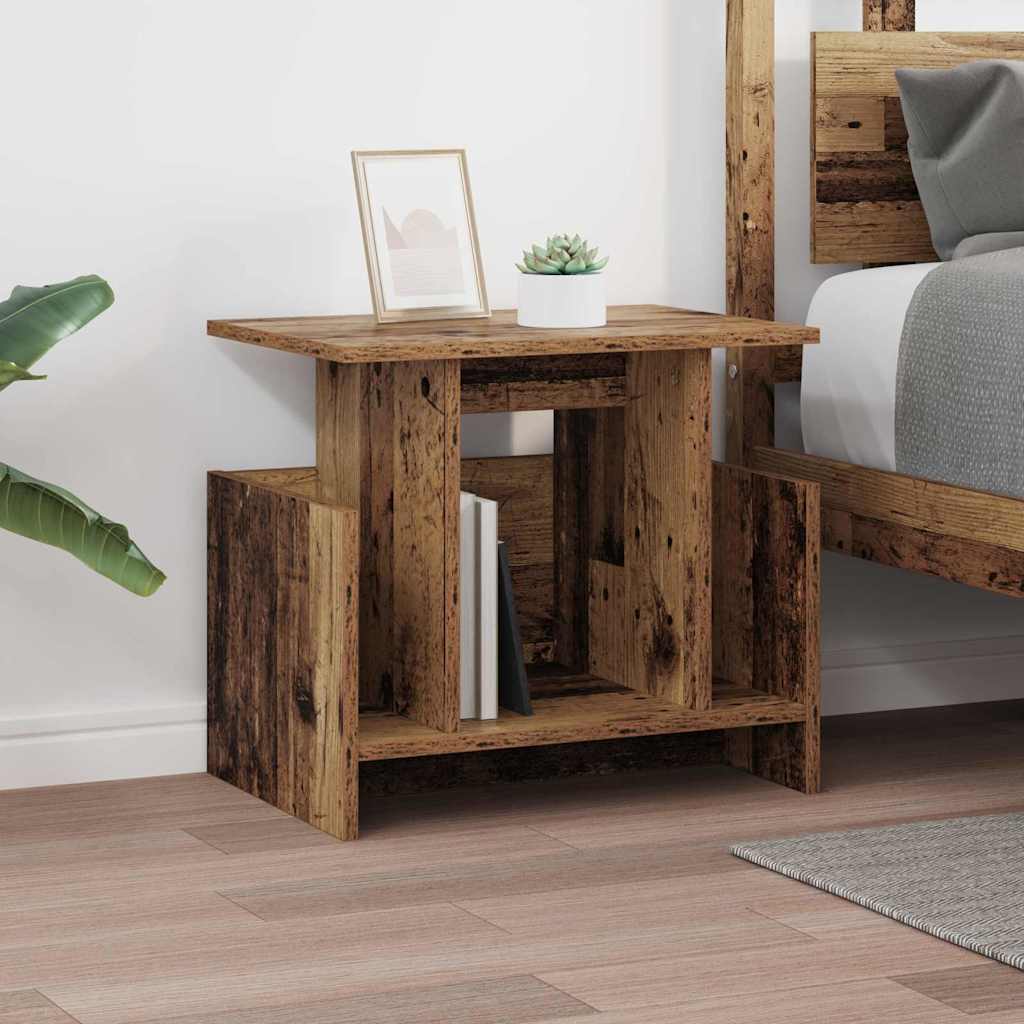 The TV stand styled as a nightstand with a small plant and picture frame on top