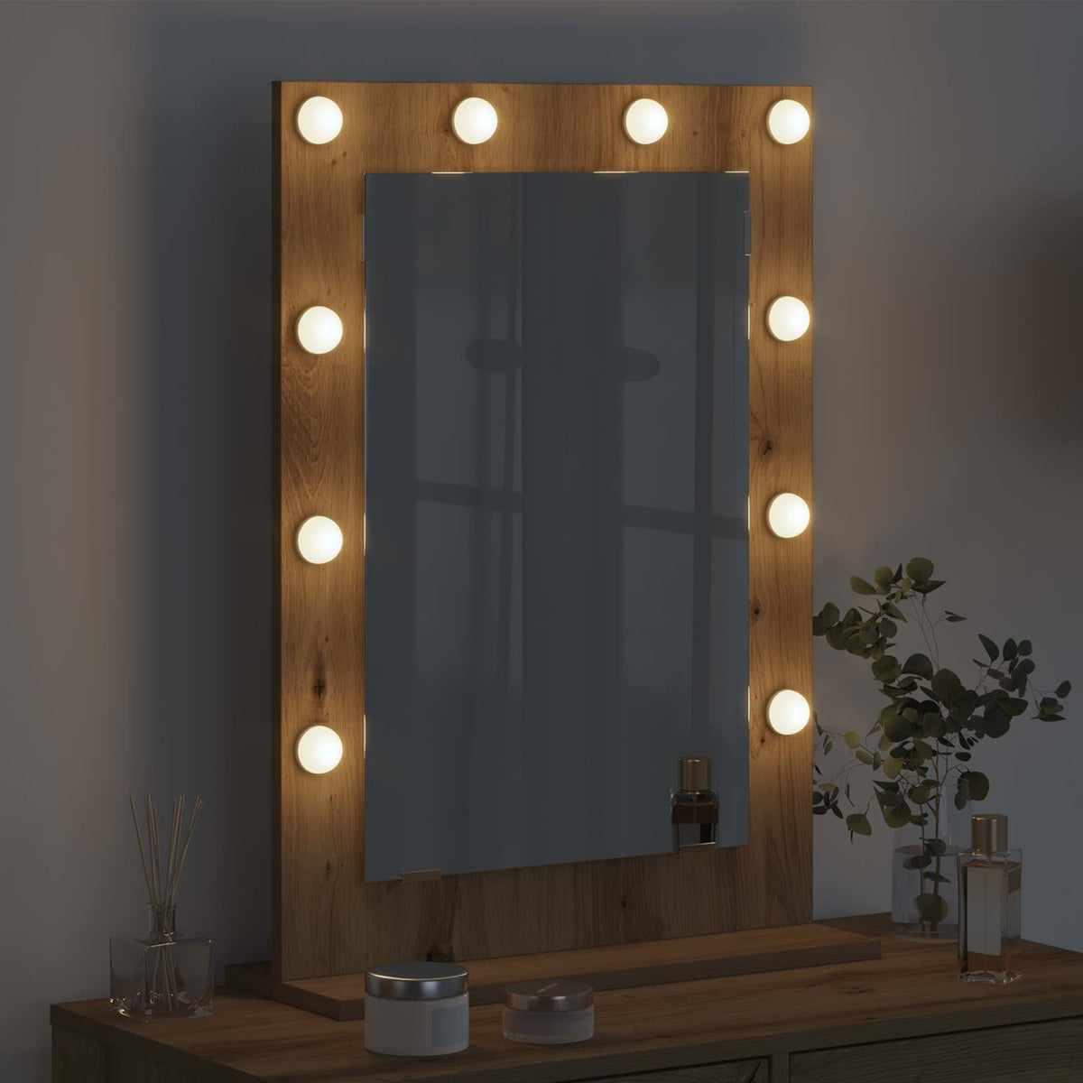 The vanity mirror with lights and shelf in a dimly lit room