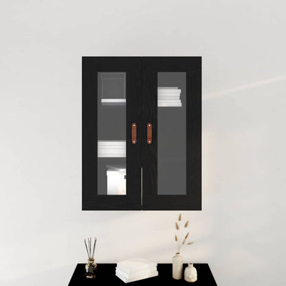 Black oak wall cabinet with glass doors mounted on a wall, shown with books and decor
