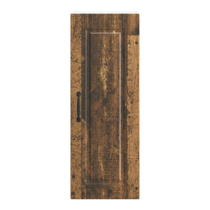 The wall cabinet door with old wood effect and a black handle