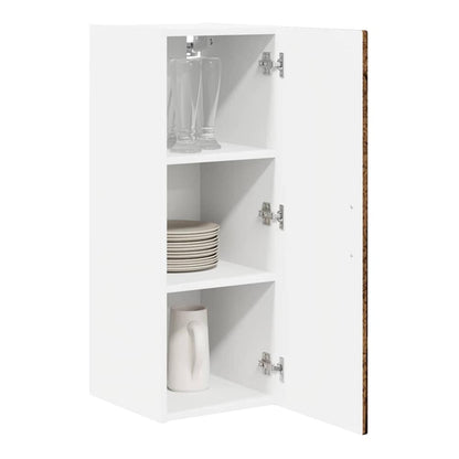 The open kitchen cabinet showing three shelves with glasses and a jug inside