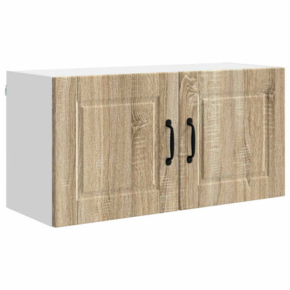 The kitchen cabinet with a wood effect finish and black handles on a white background