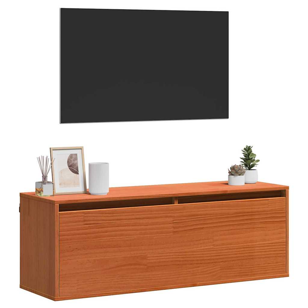 the wall cabinet placed under a television with decorative items on top